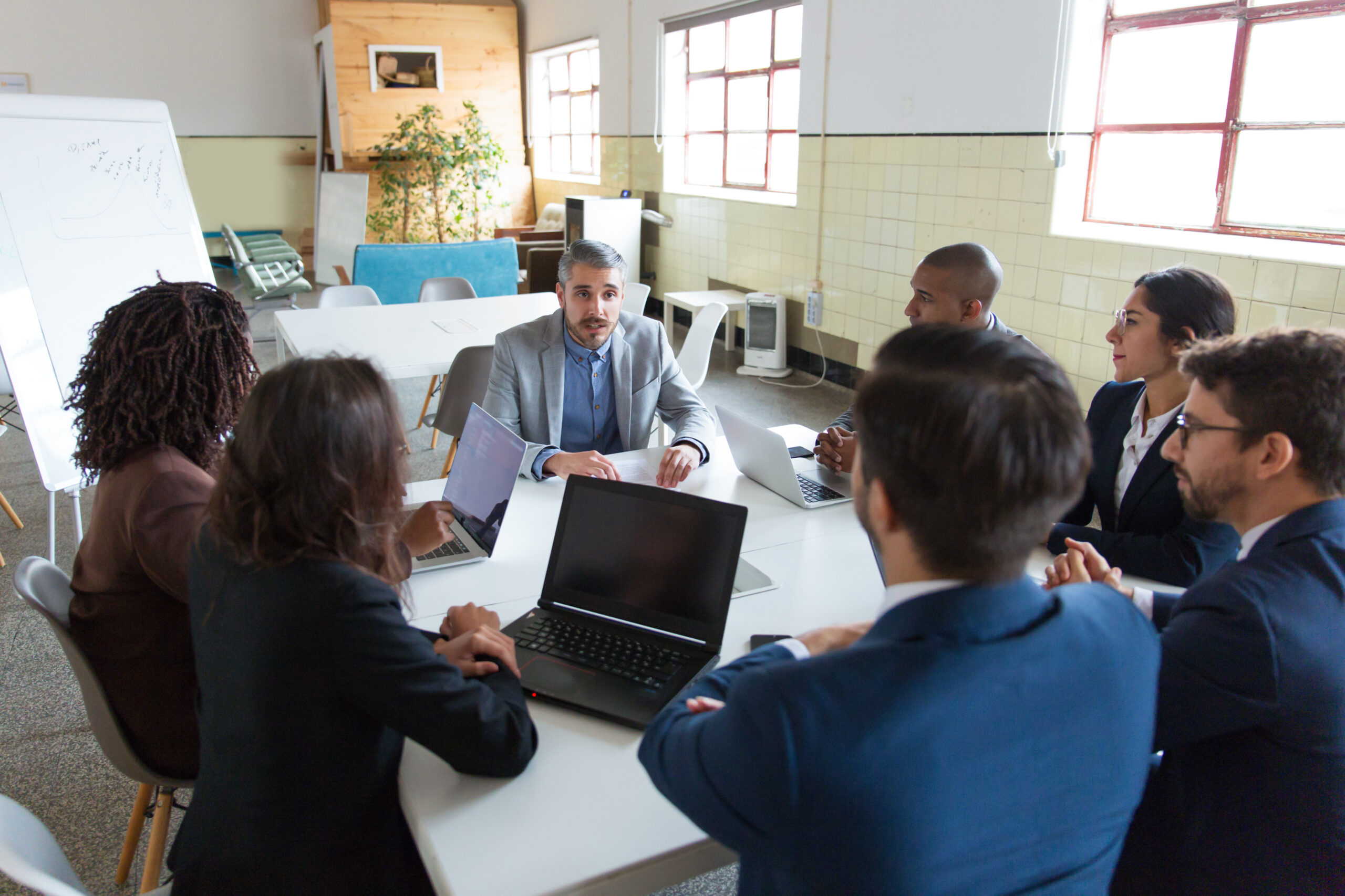 confident leader talking to subordinates
